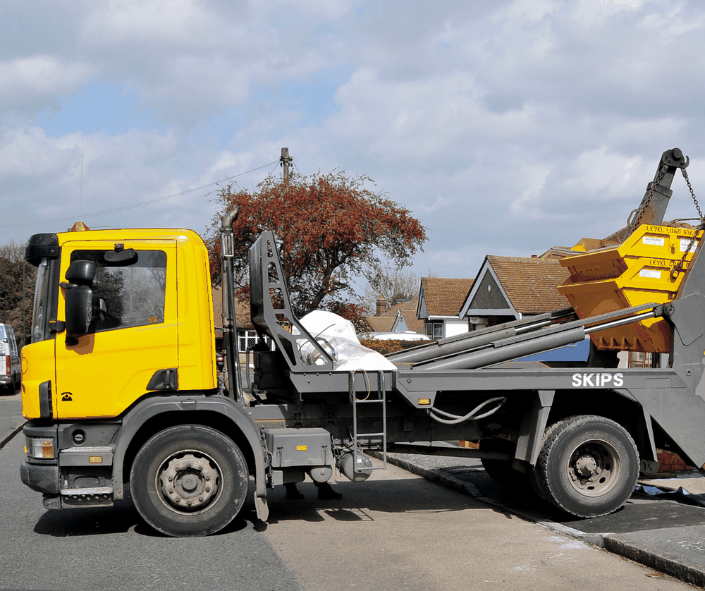 Can a Skip Be Lifted Over a Wall