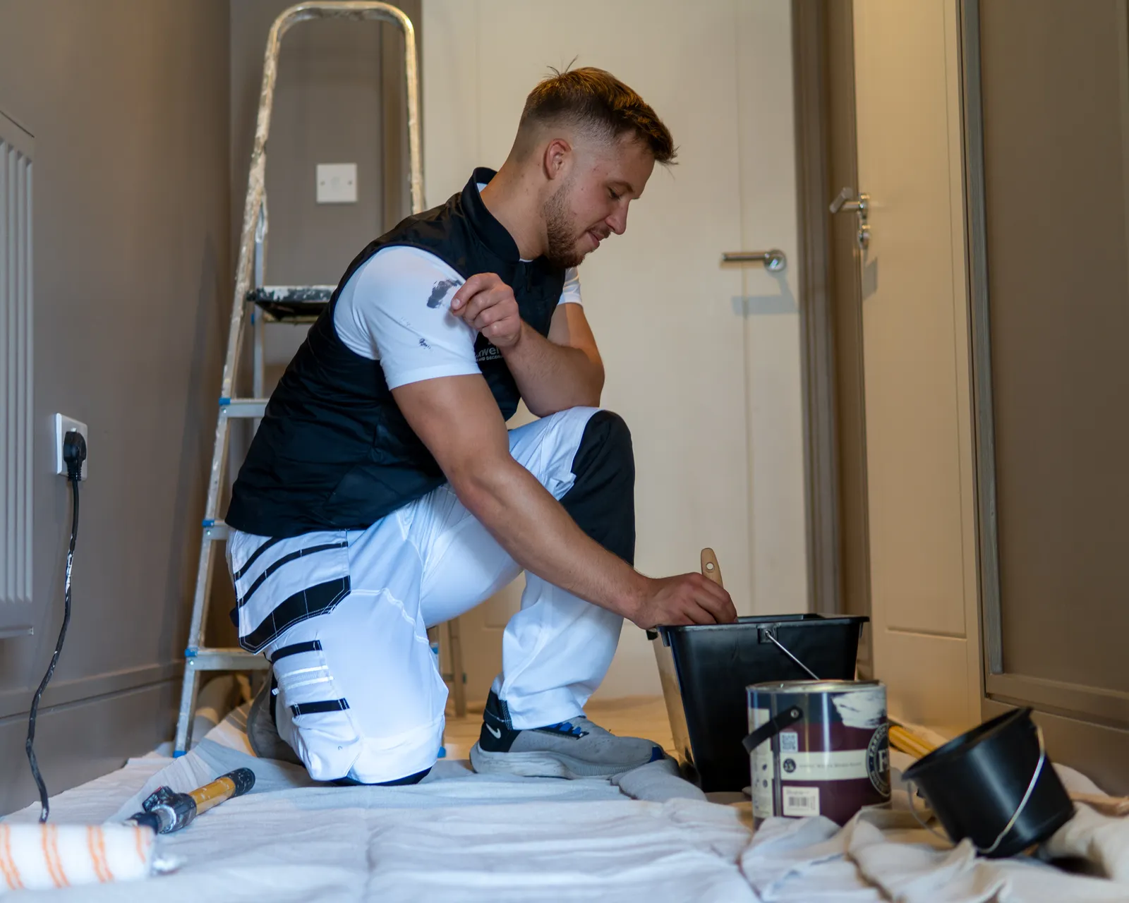 Painter In Hallway