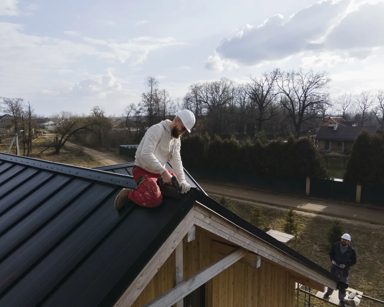 Full Shot Roofer On Roof