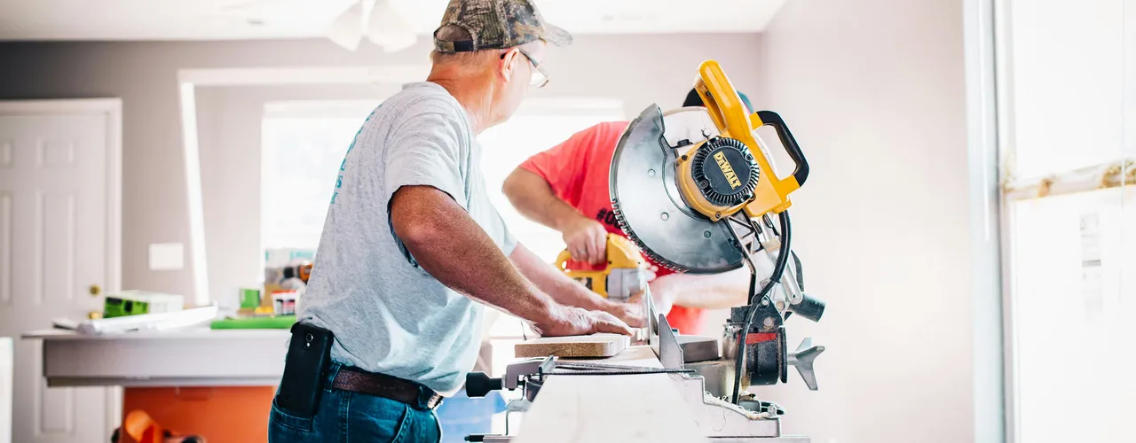 Carpenter Cutting Wood With Circle Saw