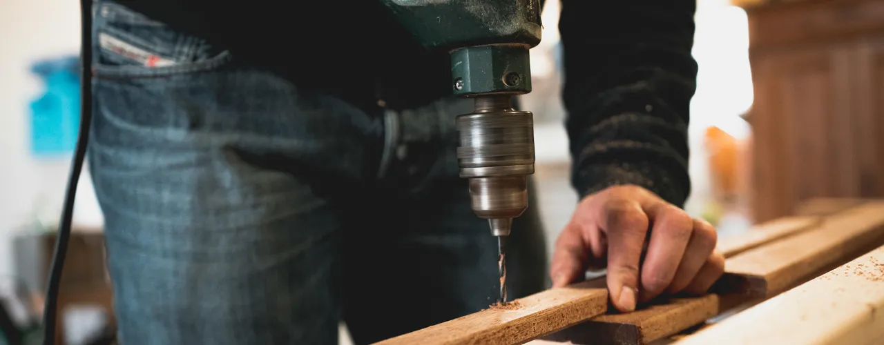 Builder With Drill And Wood