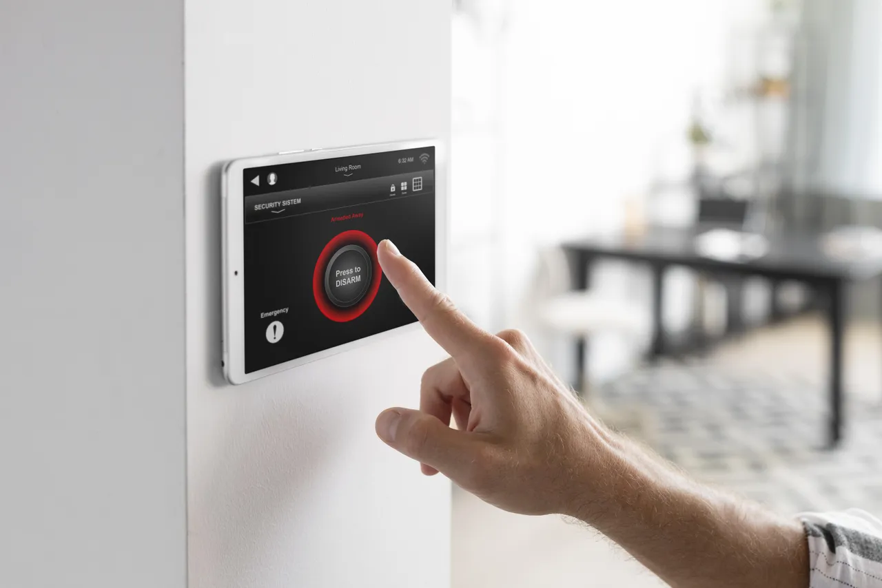 Man Using Alarm System
