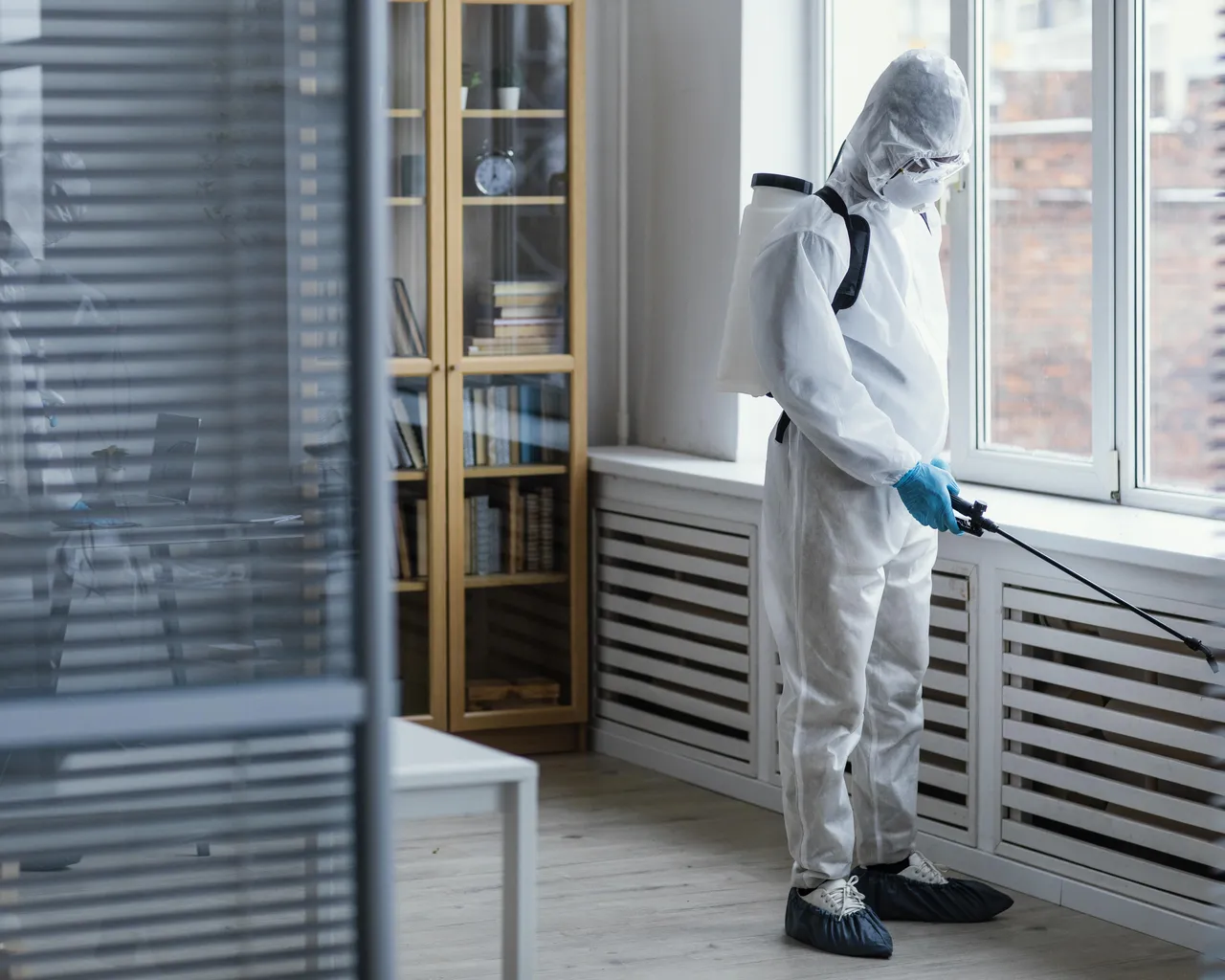 Guy In Hazmat Doing Pest Control