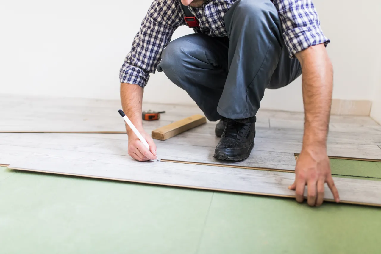 Floorer With Laminated Flooring Boards